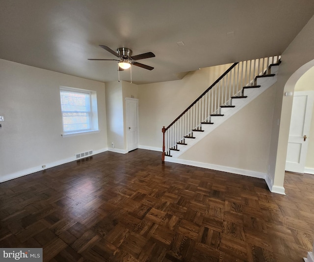 interior space with ceiling fan