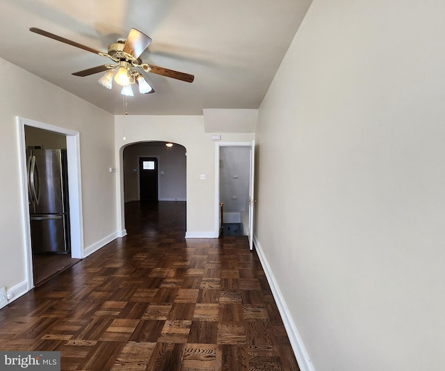 corridor featuring dark parquet flooring