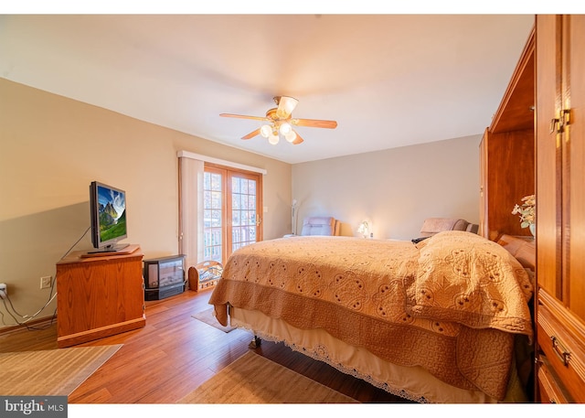 bedroom with ceiling fan and light hardwood / wood-style floors