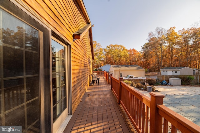 deck featuring a shed