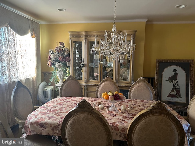 dining room with a notable chandelier and ornamental molding