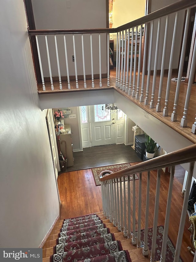 staircase featuring hardwood / wood-style flooring