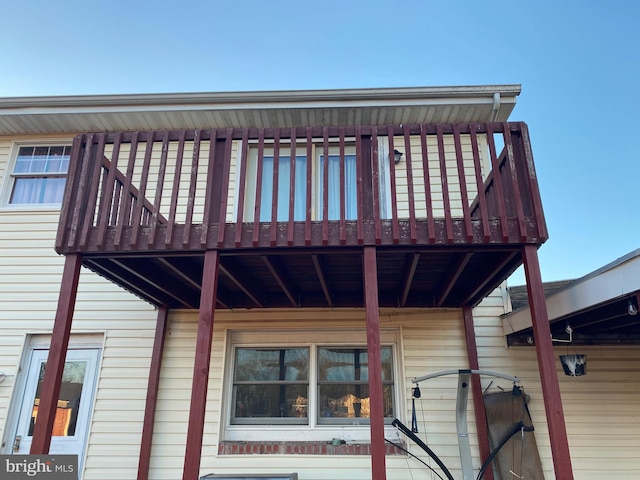 view of home's exterior with a balcony and a deck