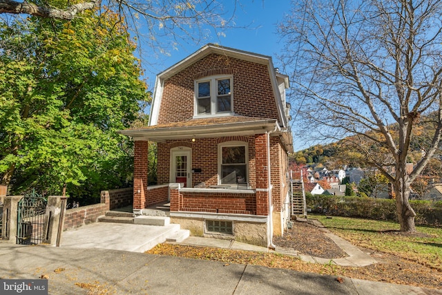 view of property with covered porch