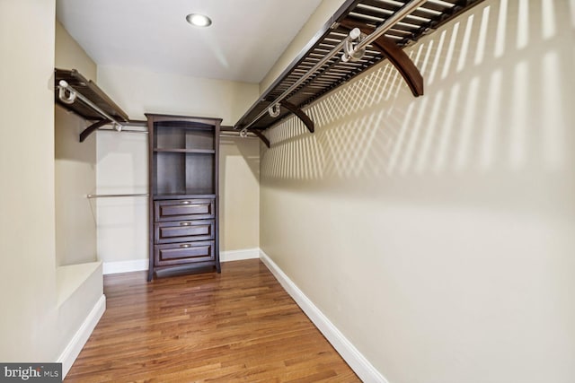 walk in closet featuring hardwood / wood-style floors