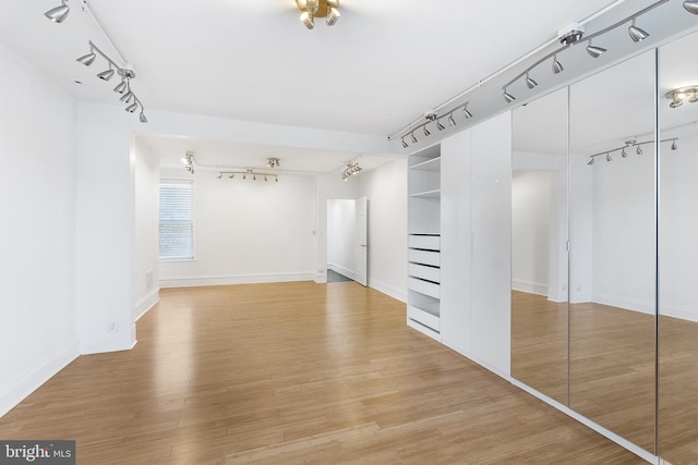 walk in closet featuring light wood-type flooring