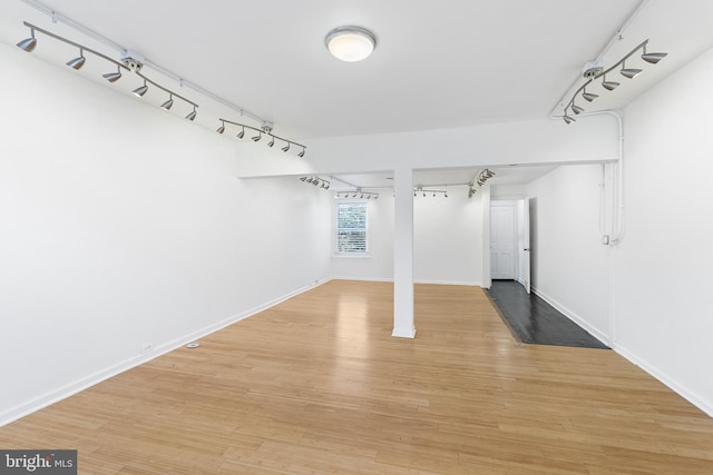 basement featuring hardwood / wood-style floors