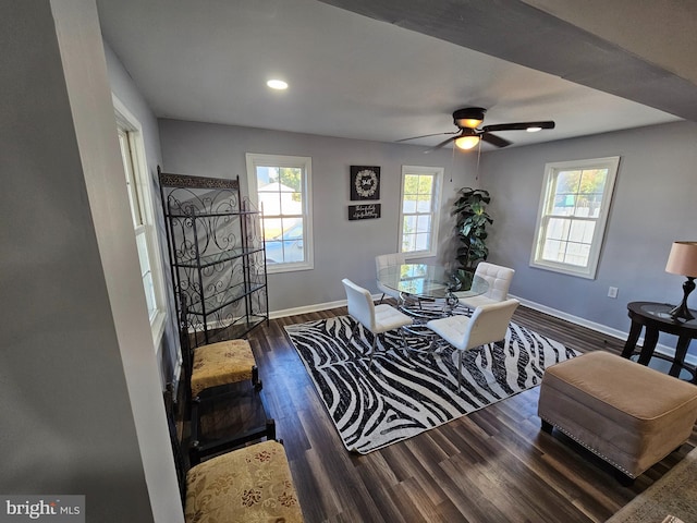 dining space featuring dark hardwood / wood-style floors and ceiling fan