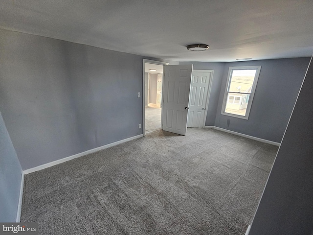 unfurnished bedroom featuring carpet flooring