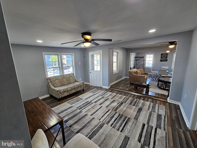 living room with ceiling fan, a healthy amount of sunlight, and hardwood / wood-style floors