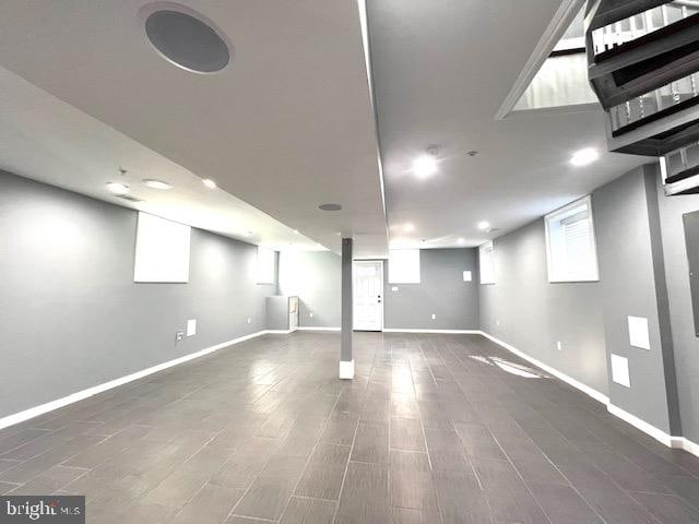 basement featuring dark hardwood / wood-style floors