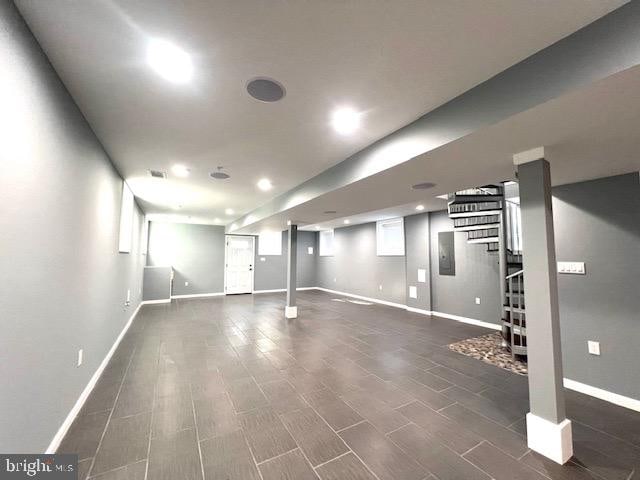 basement featuring dark wood-type flooring