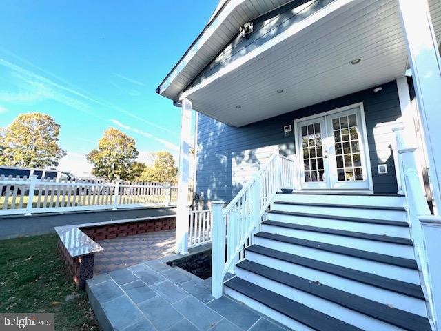 doorway to property featuring a patio