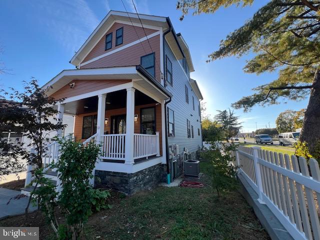 view of front of home featuring central AC unit and covered porch