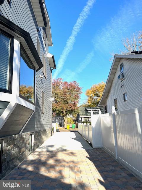 view of side of property with a patio area