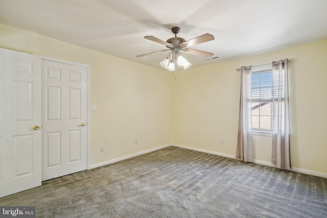 unfurnished room featuring carpet flooring and ceiling fan