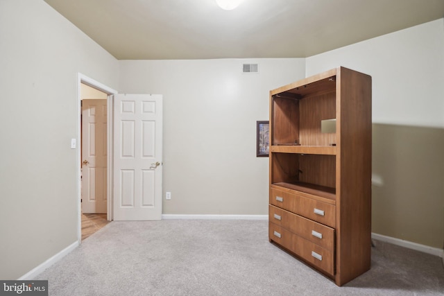 bedroom with light colored carpet