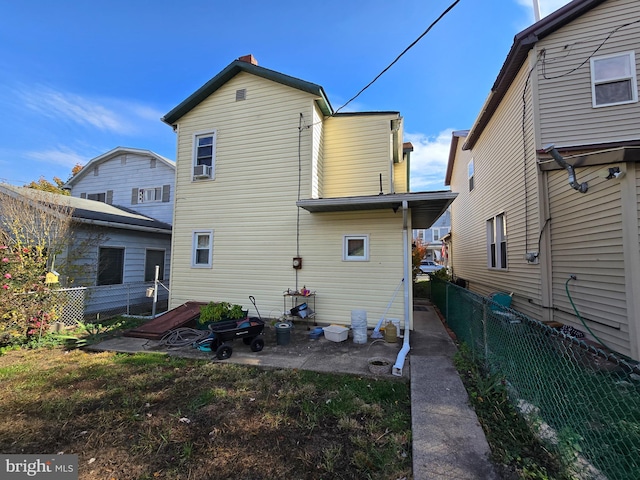 32 S F St, Keyser, WV 26726 - rear view of property featuring a fenced backyard and a patio area