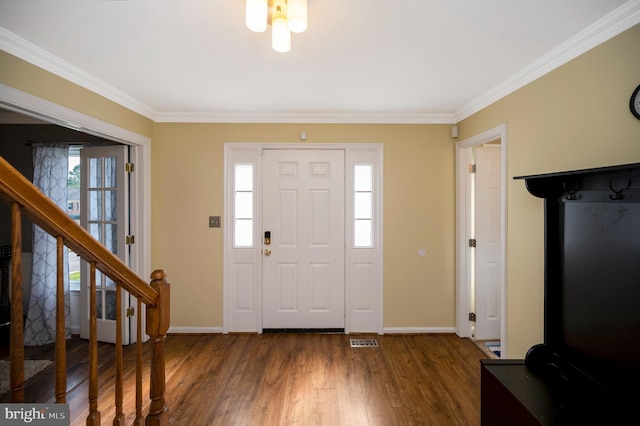 foyer featuring crown molding and dark hardwood / wood-style floors