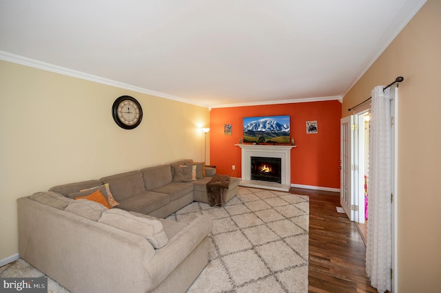 living room with crown molding and hardwood / wood-style flooring