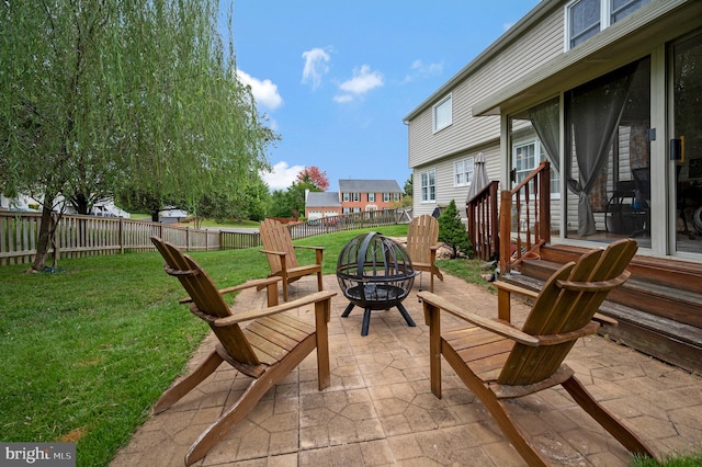 view of patio featuring an outdoor fire pit