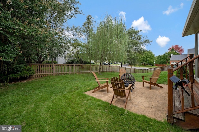 view of yard with a patio area and a fire pit