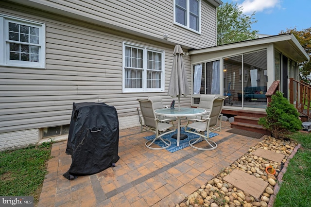 view of patio / terrace with a sunroom