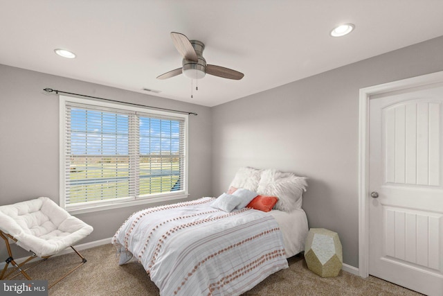 carpeted bedroom with ceiling fan