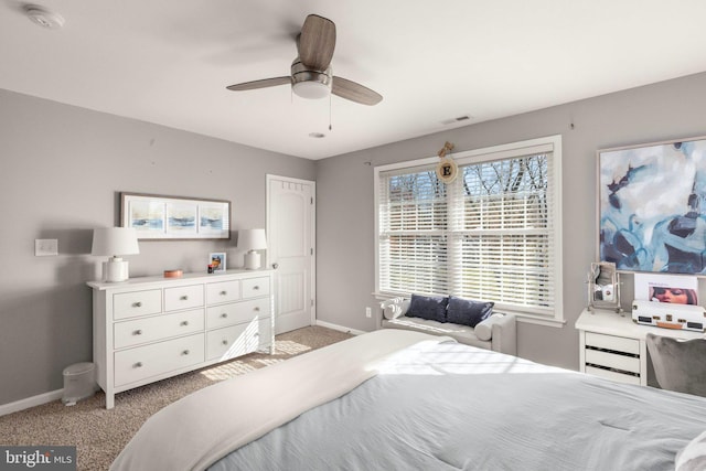 bedroom featuring ceiling fan and light colored carpet