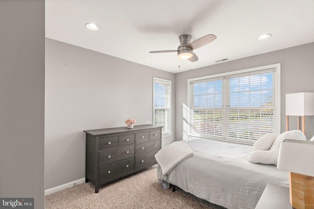 bedroom with light carpet and ceiling fan