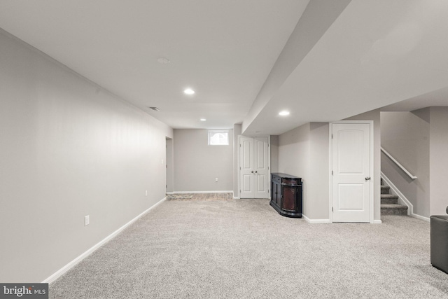 basement with light colored carpet