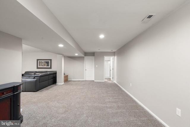 basement featuring light colored carpet