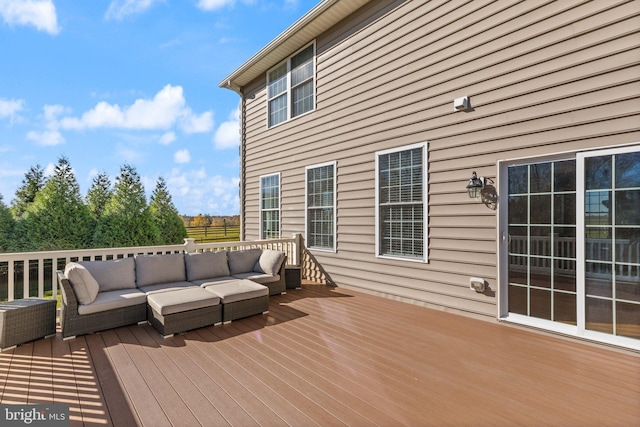 wooden terrace with an outdoor hangout area