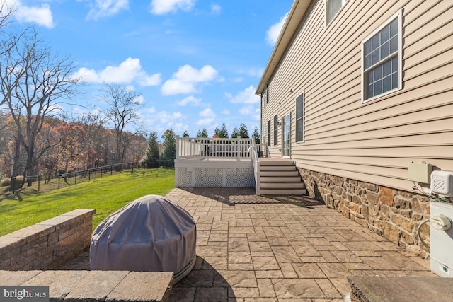 view of patio featuring grilling area and a deck