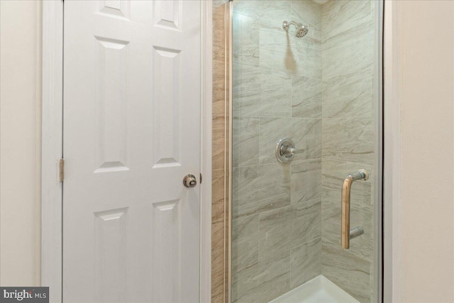 bathroom featuring an enclosed shower