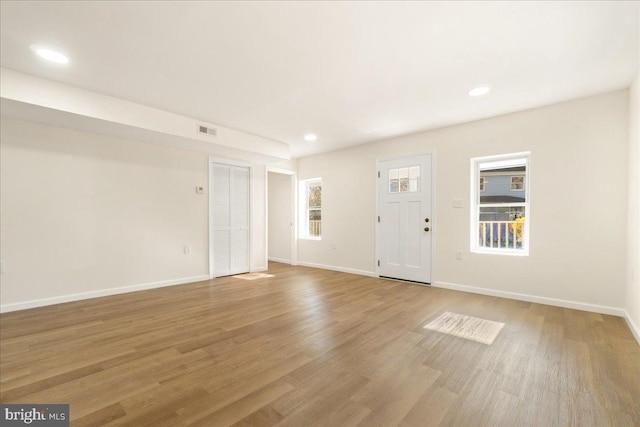 245 Knoxville Rd, Knoxville, MD 21758 - unfurnished living room featuring light wood finished floors, baseboards, and recessed lighting