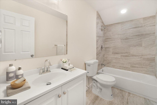 full bathroom with tiled shower / bath combo, toilet, wood-type flooring, and vanity