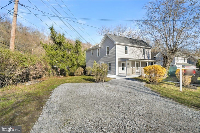 245 Knoxville Rd, Knoxville, MD 21758 - view of front of property with a porch, a front yard, and gravel driveway