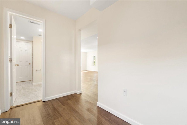 hallway featuring hardwood / wood-style floors