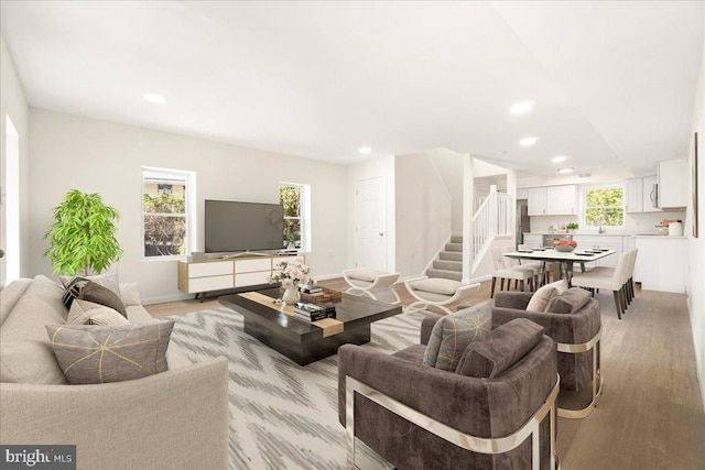 245 Knoxville Rd, Knoxville, MD 21758 - living room with stairway, light wood-style floors, recessed lighting, and baseboards