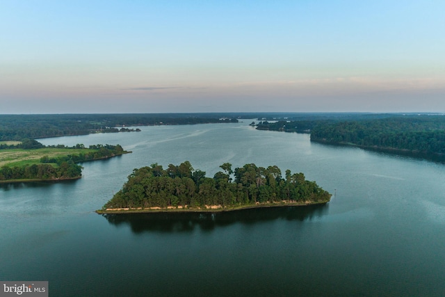 aerial view at dusk with a water view