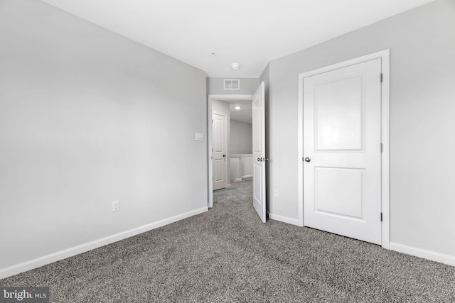 unfurnished bedroom with carpet floors