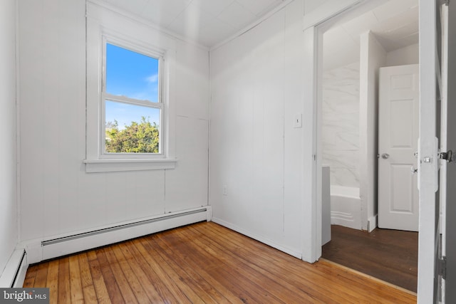 227 Columbus Ave, Trenton, NJ 08629 - unfurnished bedroom with ornamental molding, light wood-type flooring, and a baseboard heating unit