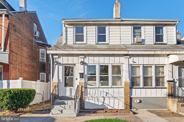 227 Columbus Ave, Trenton, NJ 08629 - view of front of home with board and batten siding, fence, and entry steps