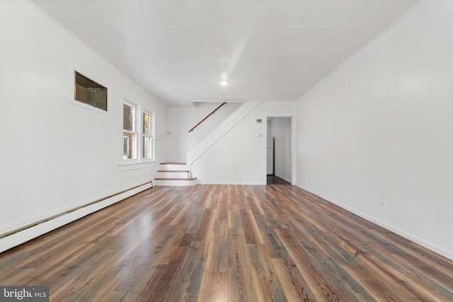 unfurnished living room with baseboard heating, crown molding, and dark hardwood / wood-style flooring