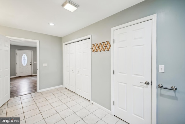 unfurnished bedroom with a closet and light wood-type flooring