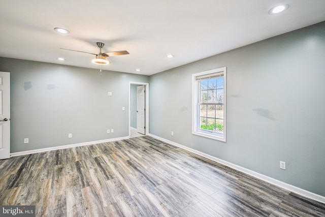 unfurnished room featuring hardwood / wood-style floors and ceiling fan