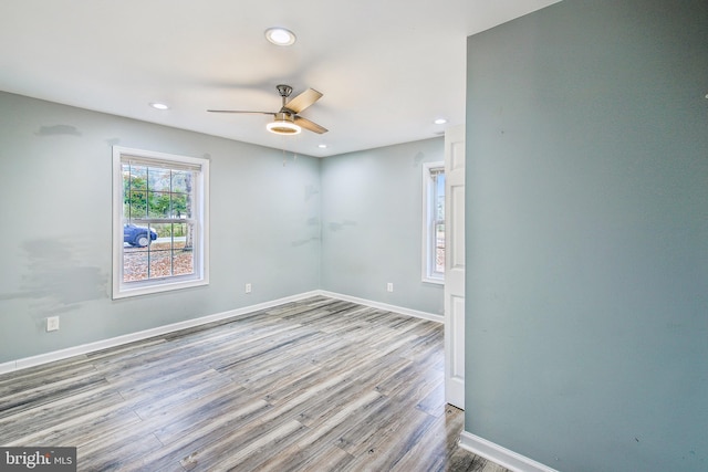 empty room featuring light wood-type flooring and ceiling fan