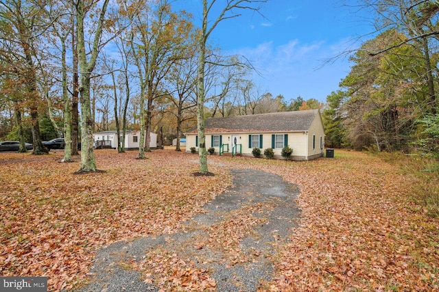 ranch-style home with central air condition unit