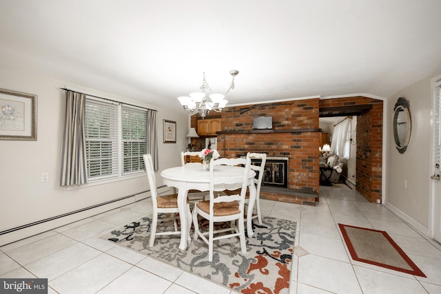 tiled dining space with a notable chandelier, a baseboard radiator, and a brick fireplace